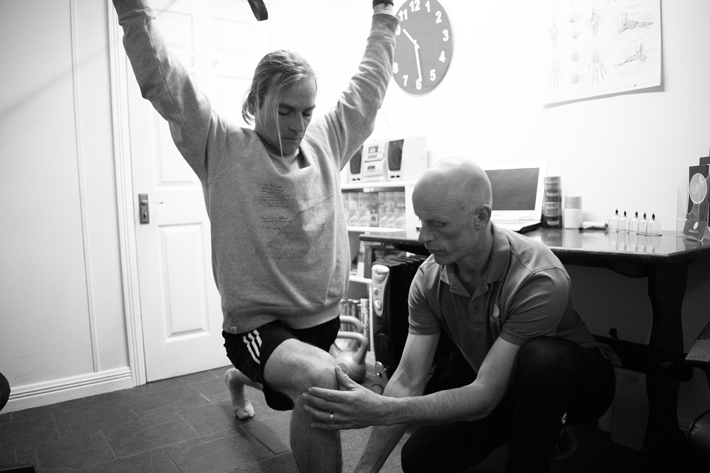 Physio Troy guides client through lunge